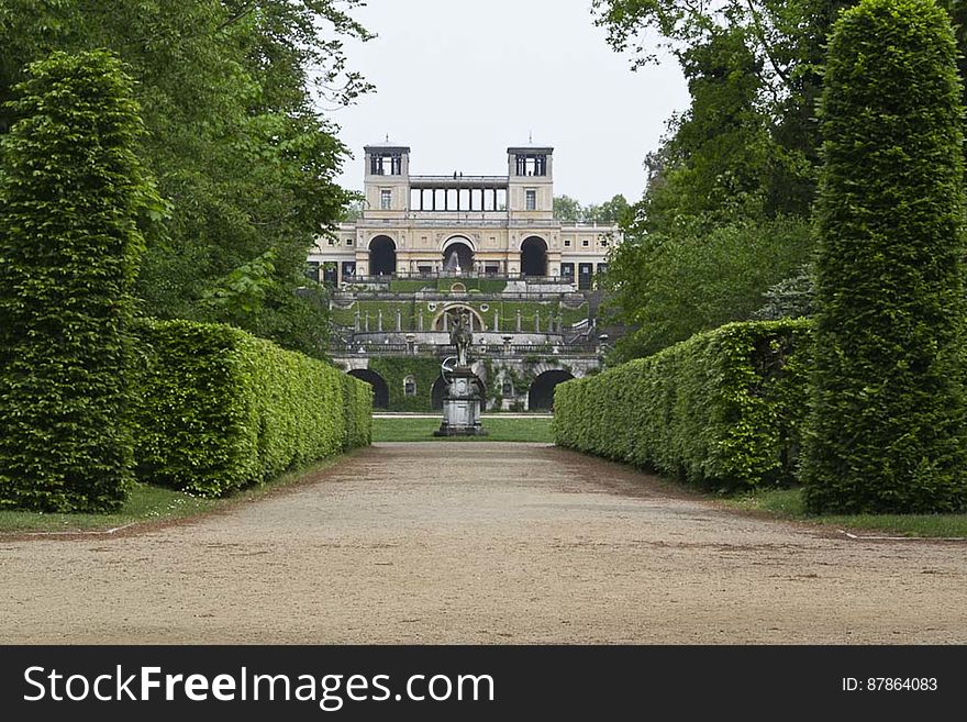 Overview of Orangery Palace and its terraces and garden from Hauptalle - main avenue of Sanssouci Park. Overview of Orangery Palace and its terraces and garden from Hauptalle - main avenue of Sanssouci Park.