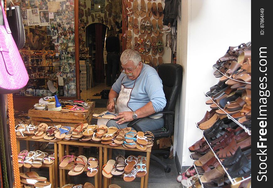 Man working in shoe shop