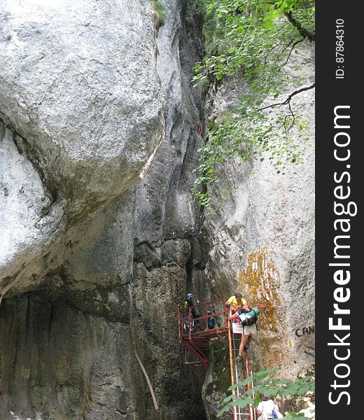 People-climbing-on-canyon-entrance