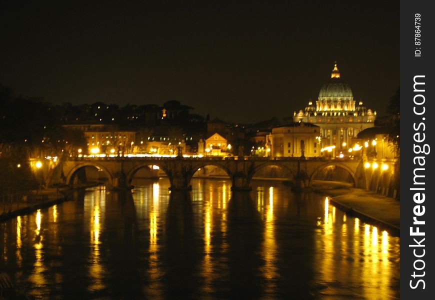 sant-angelo-bridge-and-san-pietro-basilica-at-night