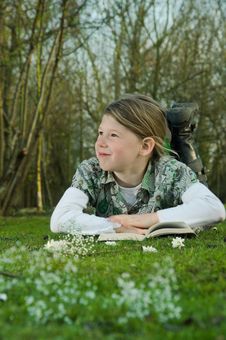 Girl Reading Book On Grass Royalty Free Stock Photography Girl Reading Book On Grass Royalty Free Stock Photography
