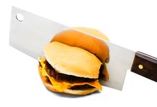 Meat Cleaver Cutting A Burger Stock Photo Meat Cleaver Cutting A Burger Stock Photo