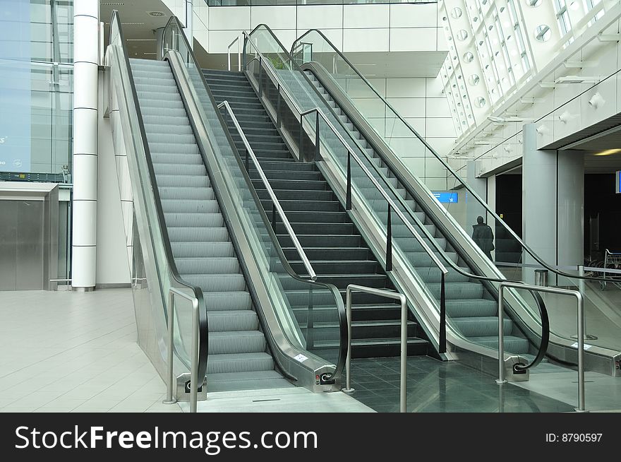 Moving escalator. Futuristic modern airport architecture