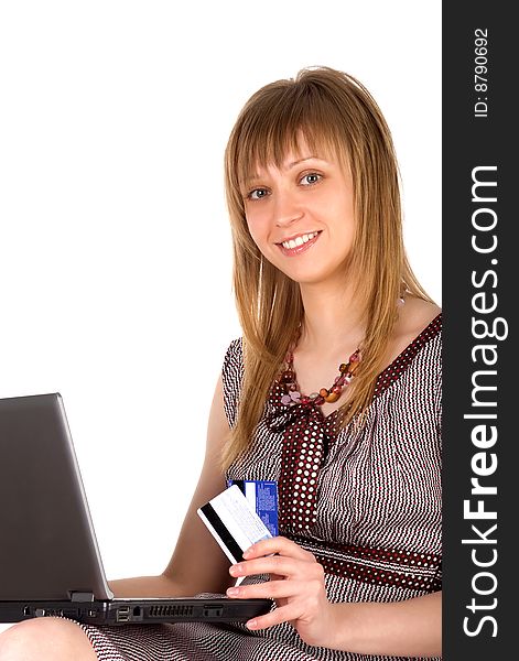 Cute woman with credit cards and laptop