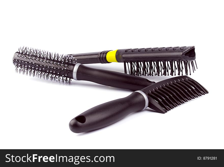 Three hairbrushes on white background