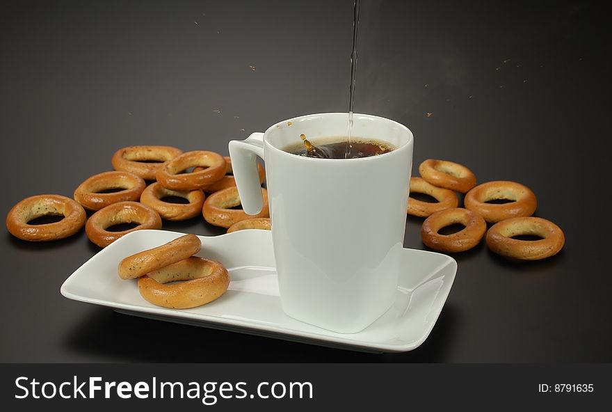 Cup of black coffee and poppy bagels
