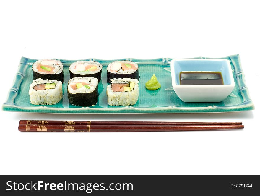 A selection of rolls sushi against a white background