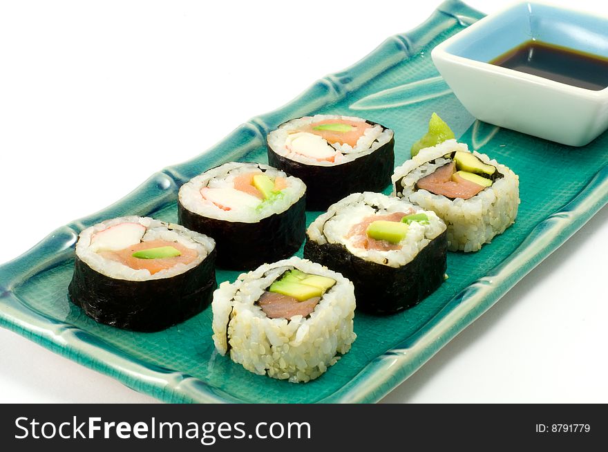 A selection of rolls sushi against a white background