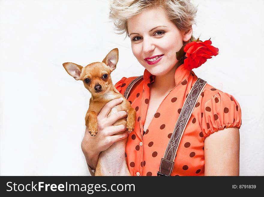 Young blond beauty posing with her pet. Young blond beauty posing with her pet.