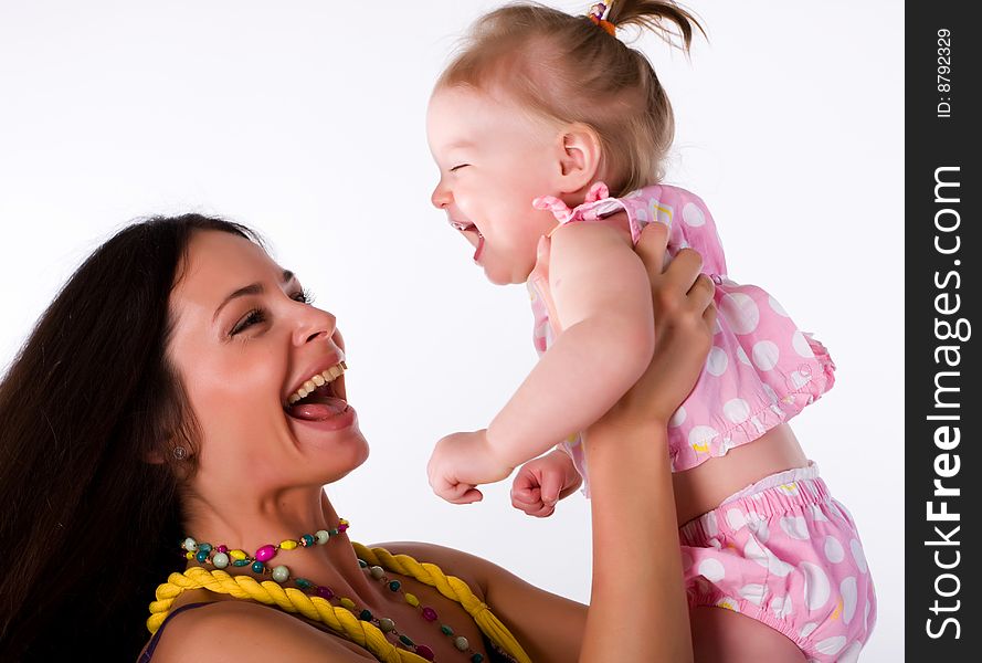 Little girl with beautiful mother isolated at white background