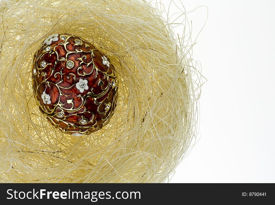Metal egg in a nest. Metal egg in a nest
