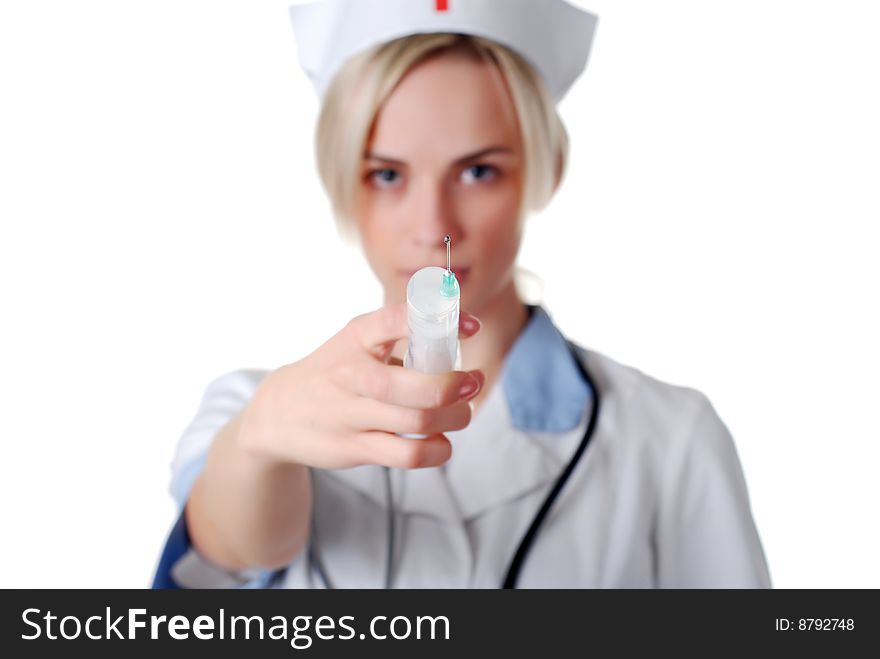 Beautiul nurse with syringe on white background