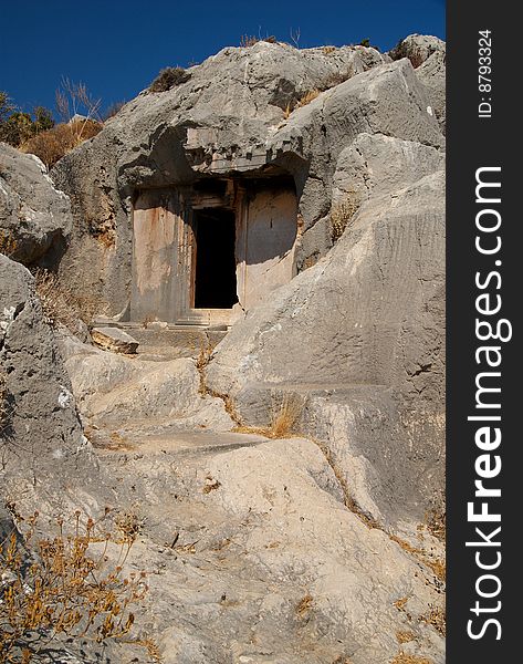 An ancient Lycian tomb cut out of the side of a hillside, Xanthos, Turkey. An ancient Lycian tomb cut out of the side of a hillside, Xanthos, Turkey