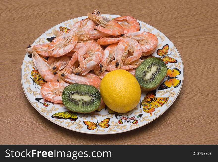 Plate is full of cooked prawns