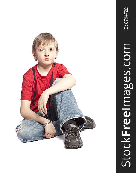 Isolated boy sitting over white background