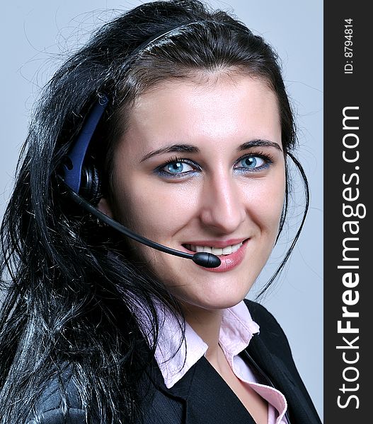 Close up portrait of businesswomen wearing headset. Close up portrait of businesswomen wearing headset