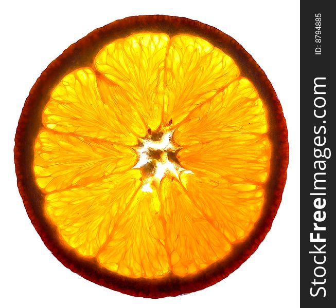 Slice of orange fruit on white, back-lighted