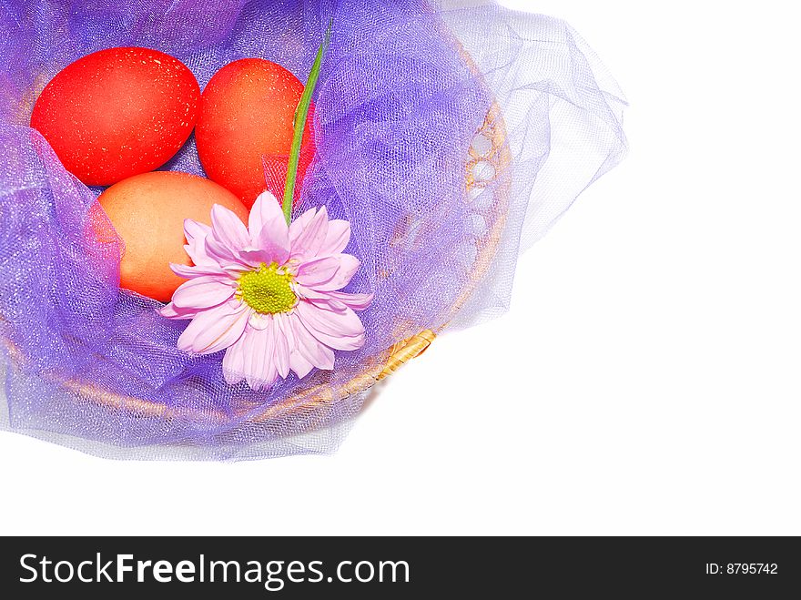 Tree red nice Easter eggs in the purple basket isolated on the white. Tree red nice Easter eggs in the purple basket isolated on the white.