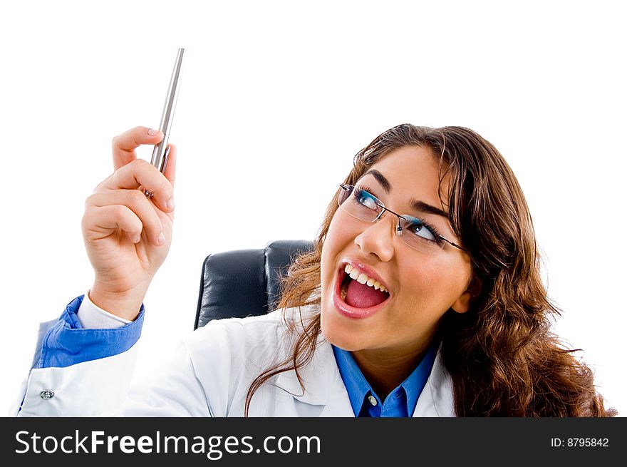 Smiling doctor looking the pen on an isolated background