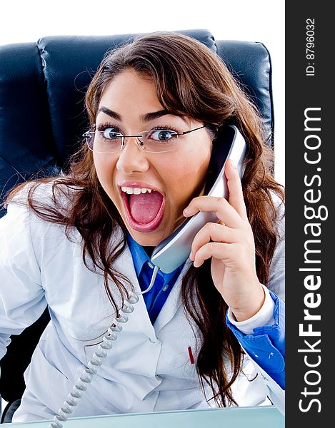Female doctor posing with phone on an isolated background