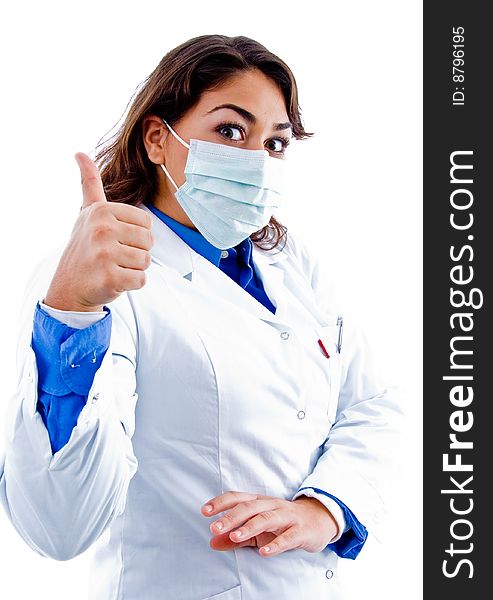 Side pose of doctor with mask and thumbs up on an isolated background