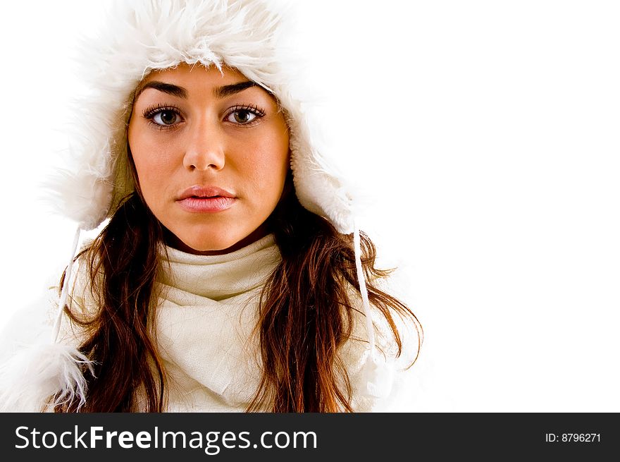 Portrait of woman with woolen cap against white background