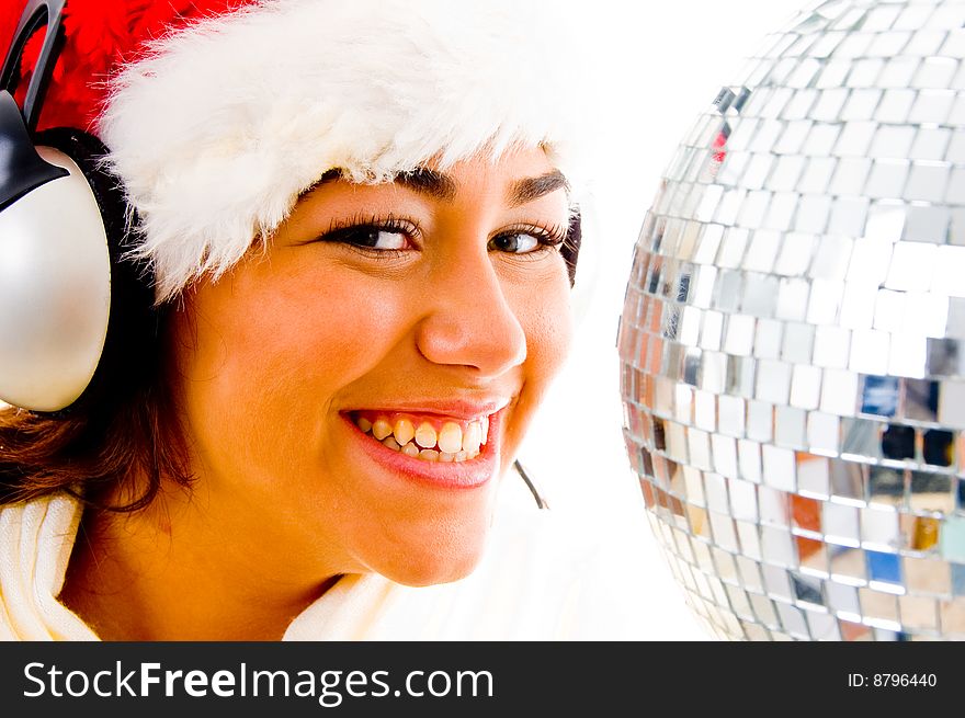 Gorgeous girl with christmas hat and wearing headphones with white background