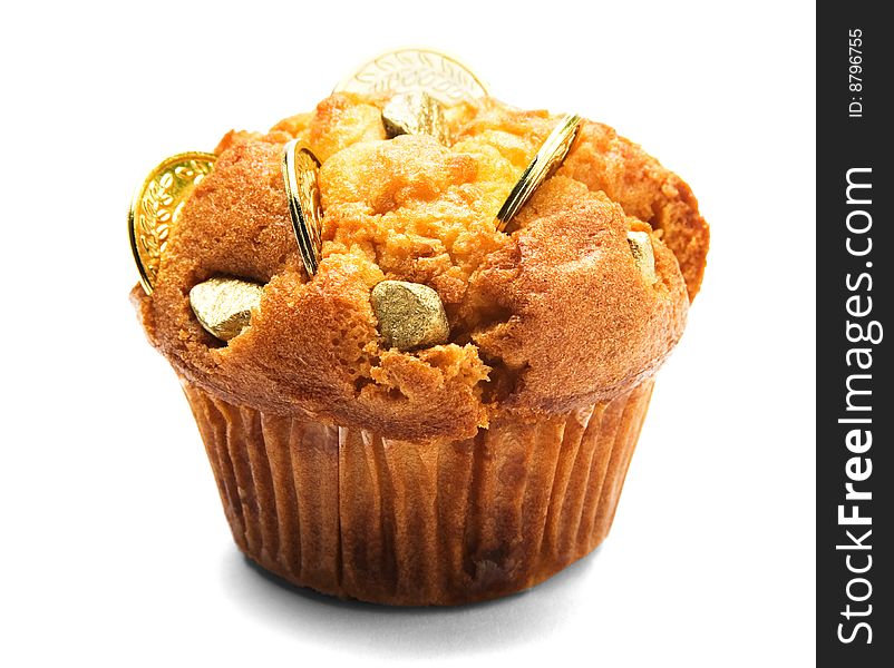 Close-up of chocolate coins on a cupcake isolated over white. Close-up of chocolate coins on a cupcake isolated over white