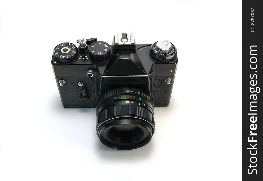 Black photo camera isolated over white background.