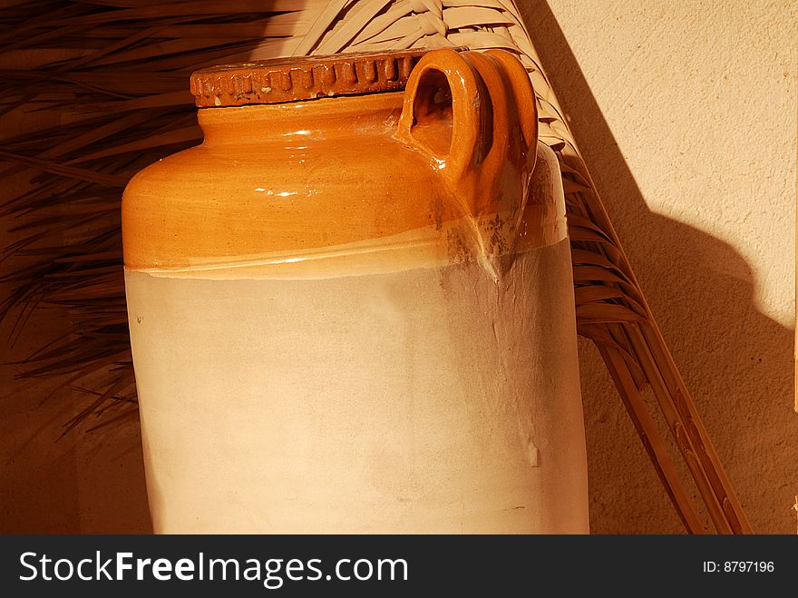 A braown glass jar with lid