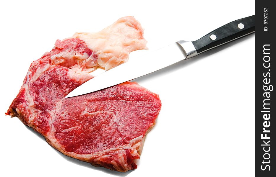 Knife cutting beef isolated over white