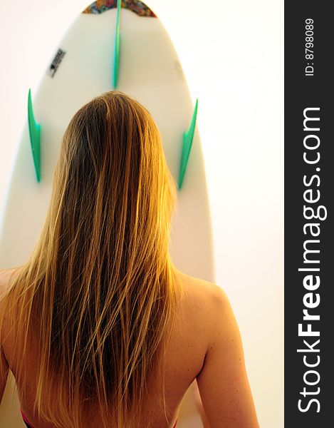 Attractive girl on white background in bikini with surfboard. Attractive girl on white background in bikini with surfboard
