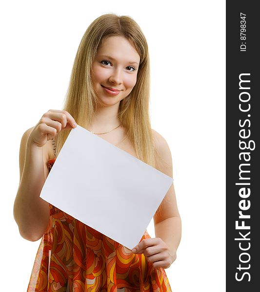Girl with a white sheet of paper for a slogan. Girl with a white sheet of paper for a slogan