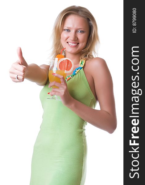 Beautiful girl in a green dress with a cocktail isolated on a white background. Beautiful girl in a green dress with a cocktail isolated on a white background