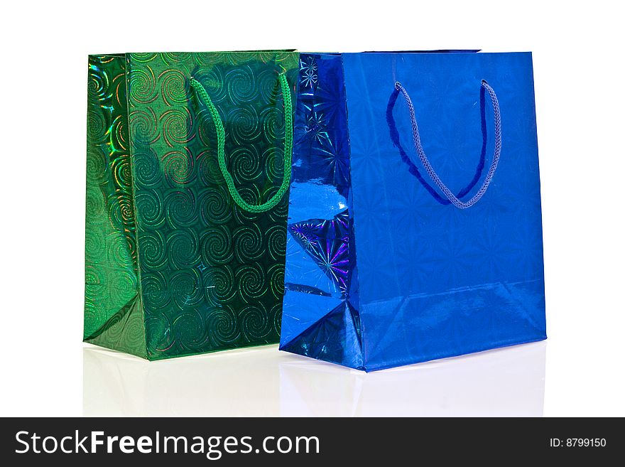 Green and dark blue packages on a white background