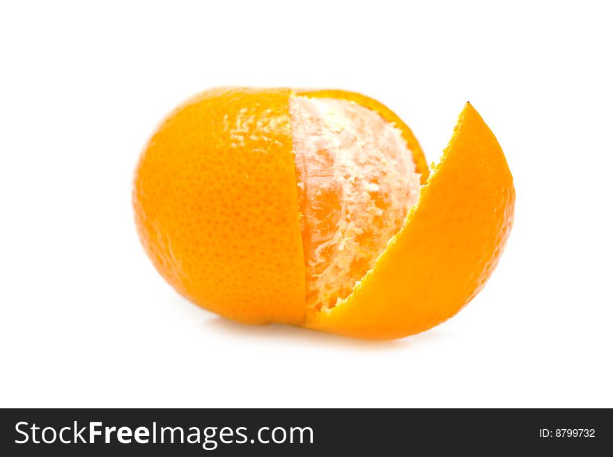 Ripe yellow mandarine on a white background
