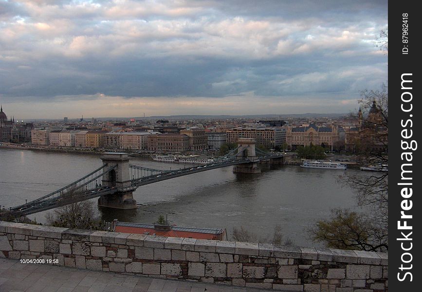 A panoramic view of the Szechenyi Chain Bridge over the Danube river in Budapest, Hungary. A panoramic view of the Szechenyi Chain Bridge over the Danube river in Budapest, Hungary.