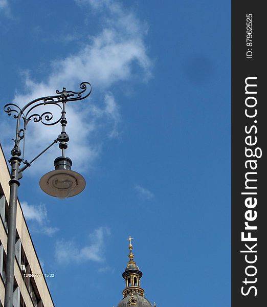 A view of the blue sky and streetlamp. A view of the blue sky and streetlamp.