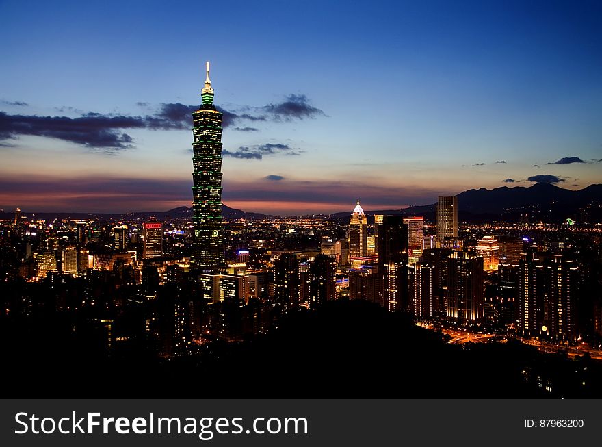 Night skyline of Taipei, Taiwan illuminated at night with 101 Tower. Night skyline of Taipei, Taiwan illuminated at night with 101 Tower.