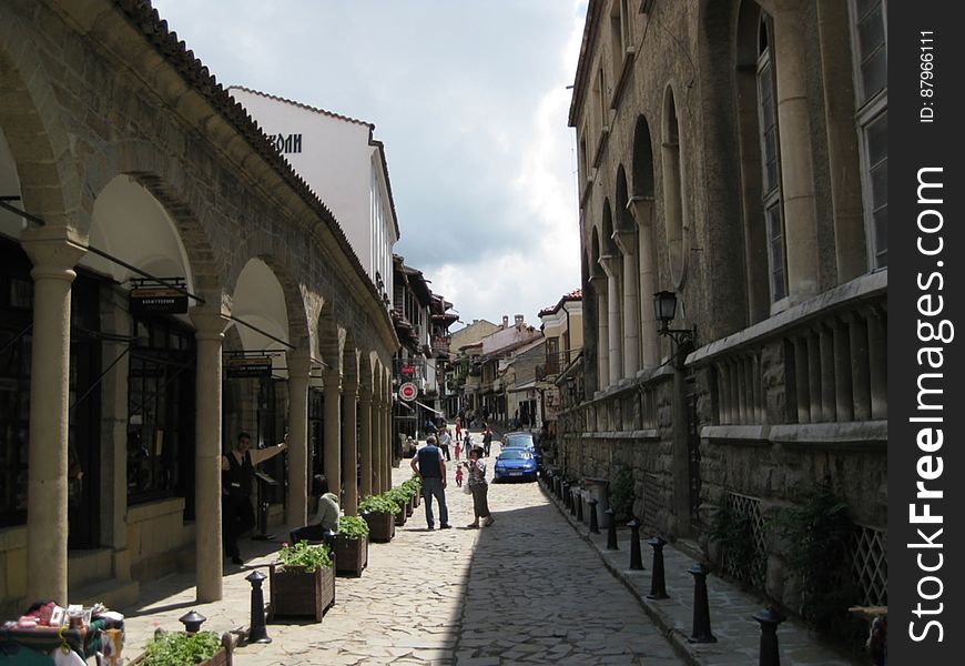 An alleyway with historical buildings in town. An alleyway with historical buildings in town.