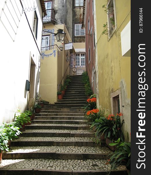 A narrow alley with stairs leading up. A narrow alley with stairs leading up.