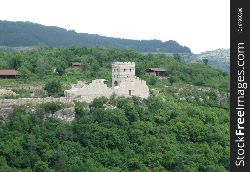 An old fortress on a green hill. An old fortress on a green hill.