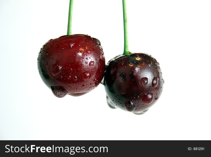 Two cherries with drop in closeup