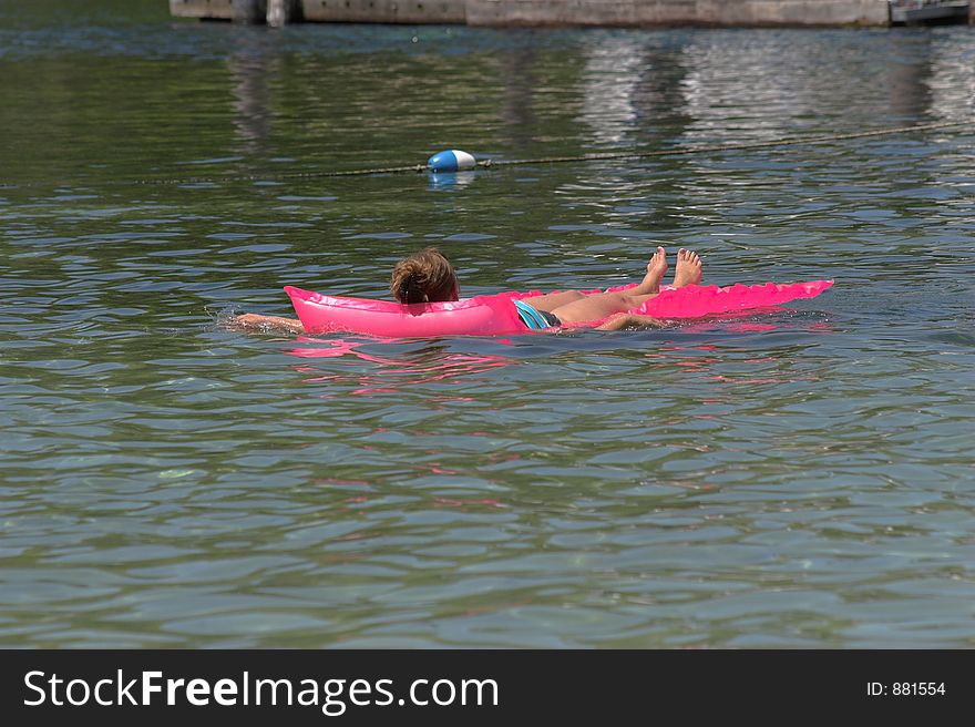 Woman swimming & playing at local lake in Florida. Woman swimming & playing at local lake in Florida