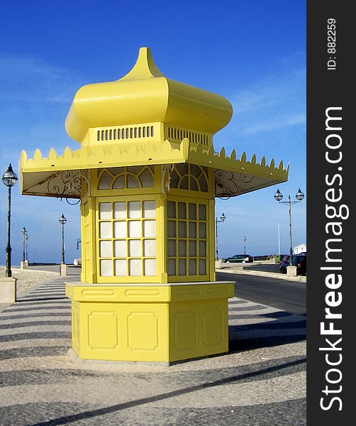 Yellow news stand near the beach