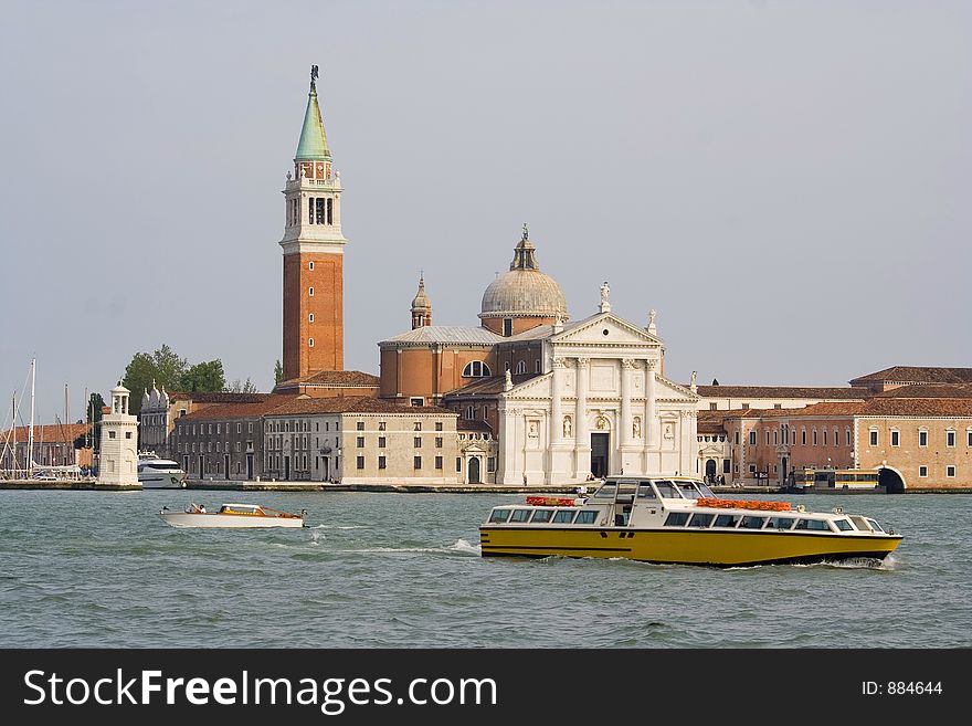 A Public boat in Venice. A Boat stop visible as background