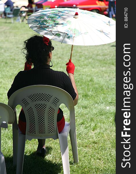 Woman Sitting with Parasol