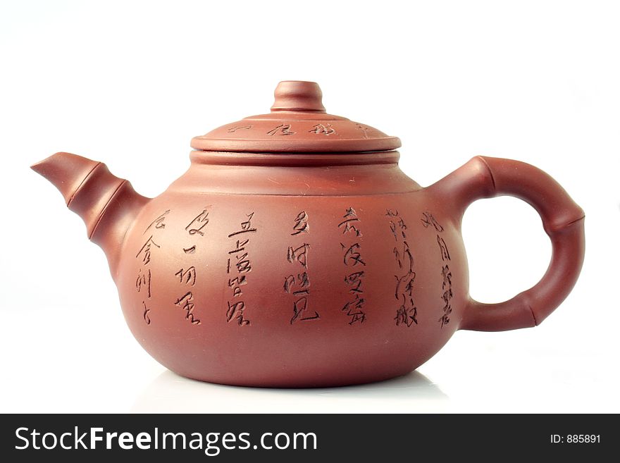 Loam teapot on white background
