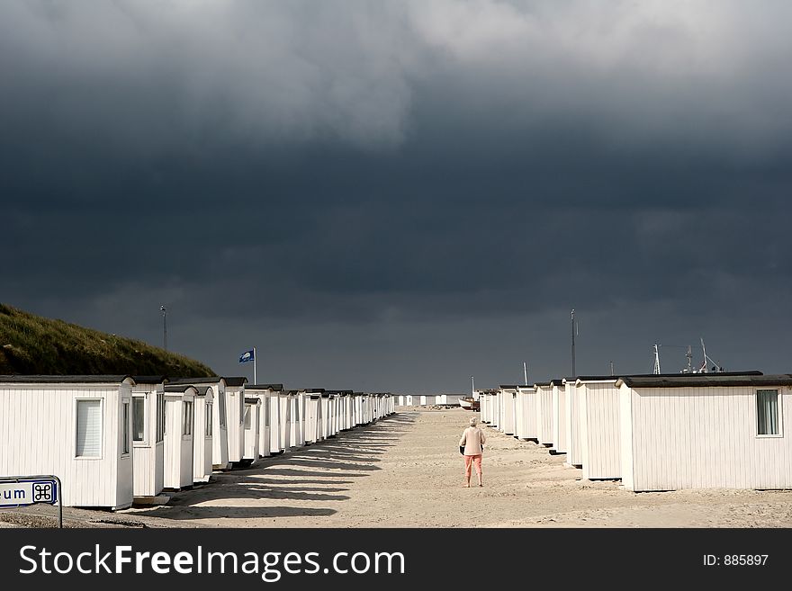 Summer in denmark:beach of loekken, beach houses in line