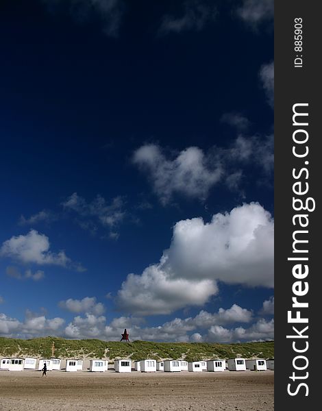 Summer in denmark:beach of loekken, beach houses in line